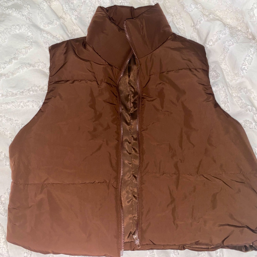 COPY - A dark brown puffer vest brand new